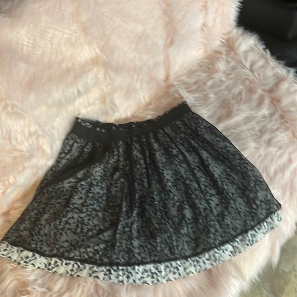 Layered skirt with stretchy waistband. Got tons of compliments and I love it.
